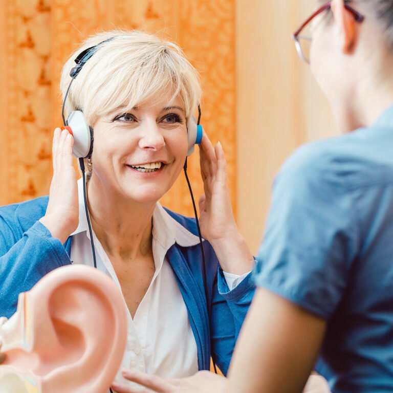 Middle-aged woman undergoing a hearing test